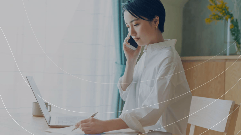 Asian women using DIDWW SIP Trunking services on a call