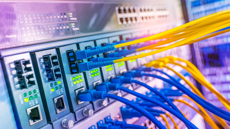 Fiber Optical cables connected to an optic ports and Network cables connected to ethernet ports. Andromeda