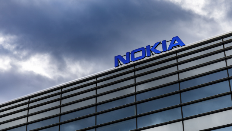 HELSINKI, FINLAND - SEPTEMBER 16, 2017: Dark clouds over Nokia brand name on top of a building in Helsinki, Finland on September 16, 2017, Nokia 5G Record
