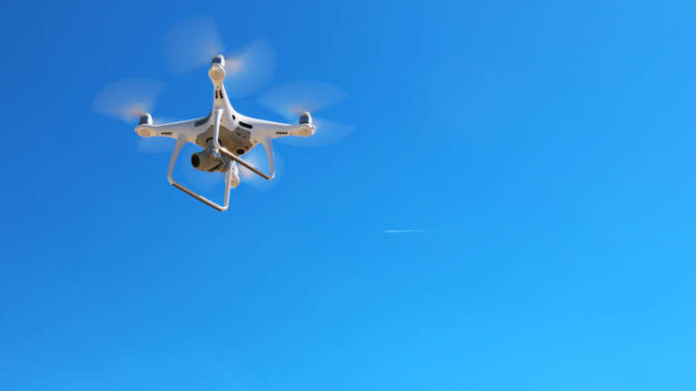 5G Drone flying in front of a blue sky
